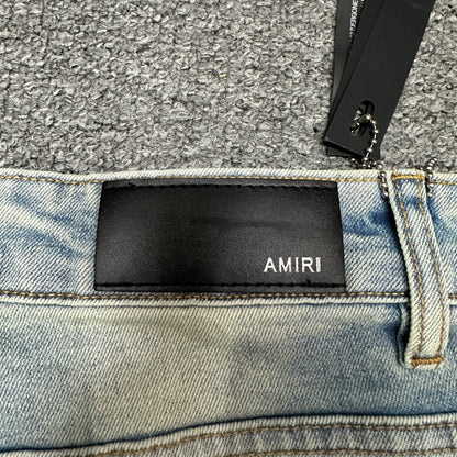 AMIRI Painter Staggered Logo Skinny Jeans Light Indigo