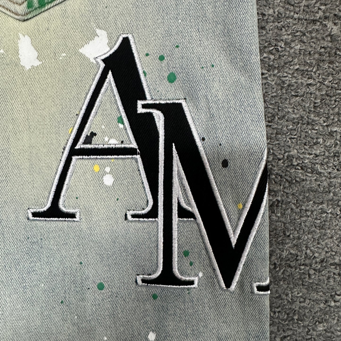 AMIRI Painter Staggered Logo Skinny Jeans Light Indigo
