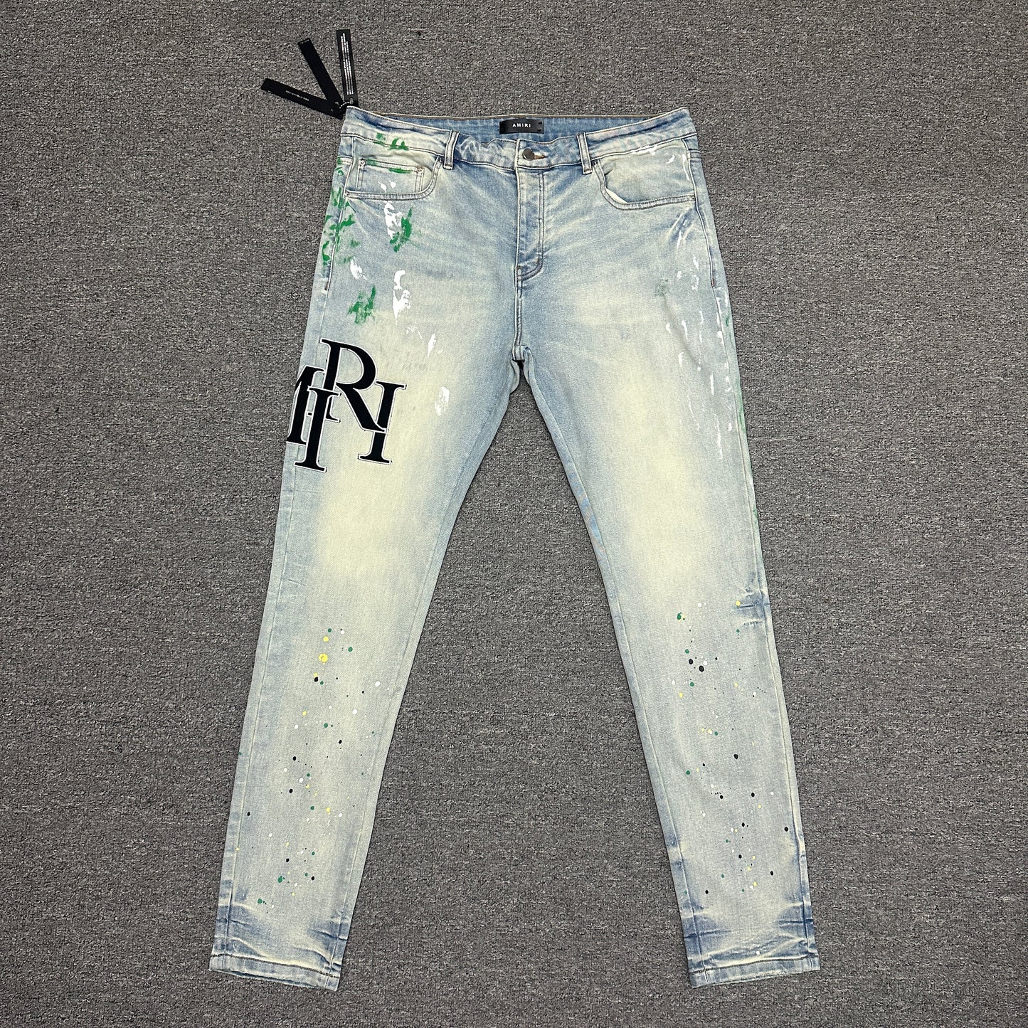 AMIRI Painter Staggered Logo Skinny Jeans Light Indigo
