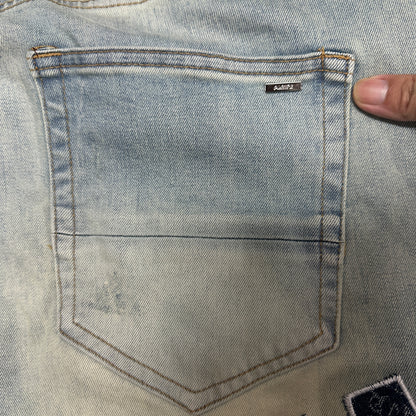 AMIRI Staggered Logo Distressed Skinny Jeans Antique Indigo