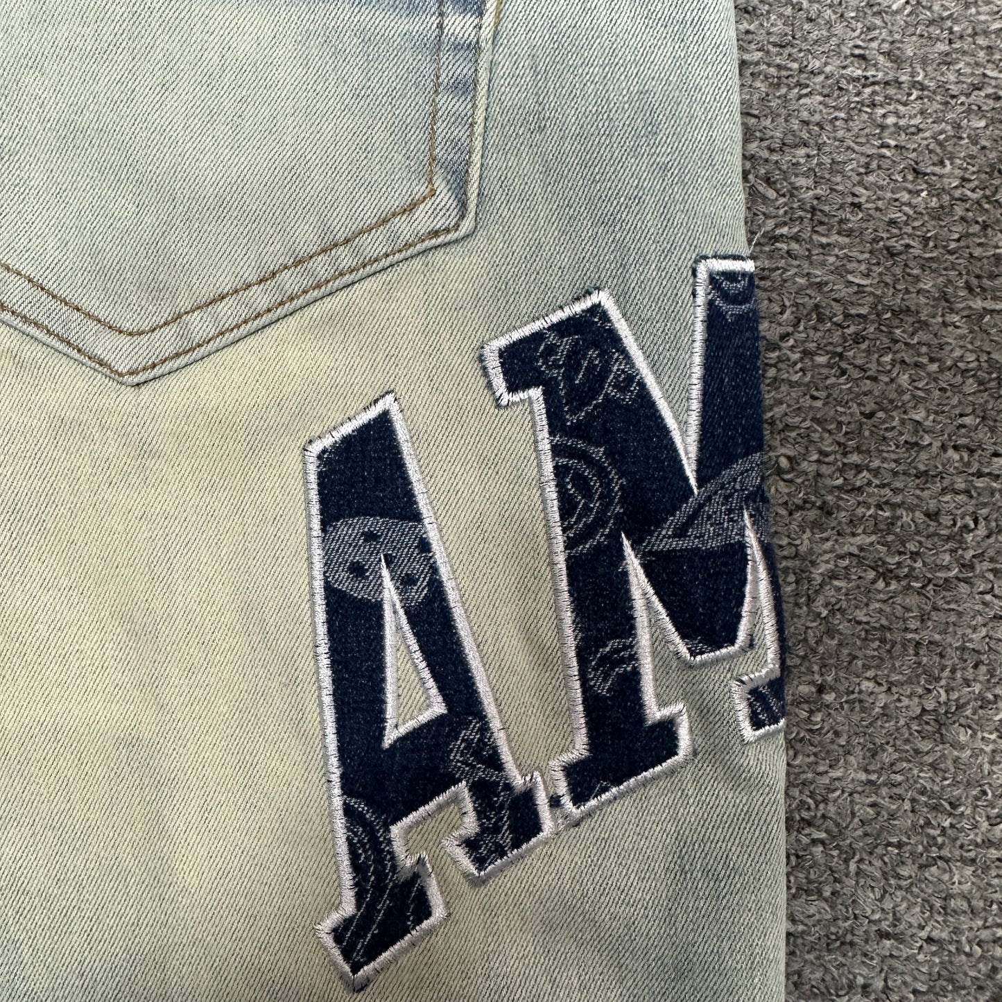 AMIRI Staggered Logo Distressed Skinny Jeans Antique Indigo