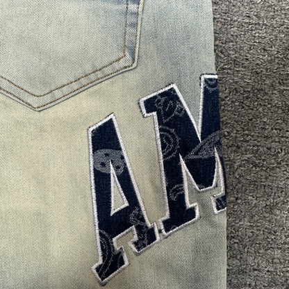 AMIRI Staggered Logo Distressed Skinny Jeans Antique Indigo