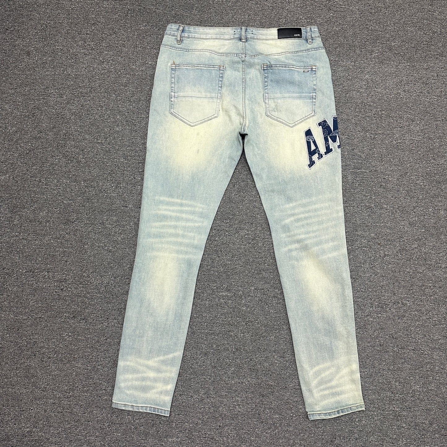 AMIRI Staggered Logo Distressed Skinny Jeans Antique Indigo