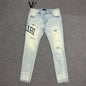 AMIRI Staggered Logo Distressed Skinny Jeans Antique Indigo