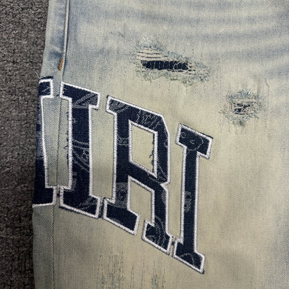 AMIRI Staggered Logo Distressed Skinny Jeans Antique Indigo