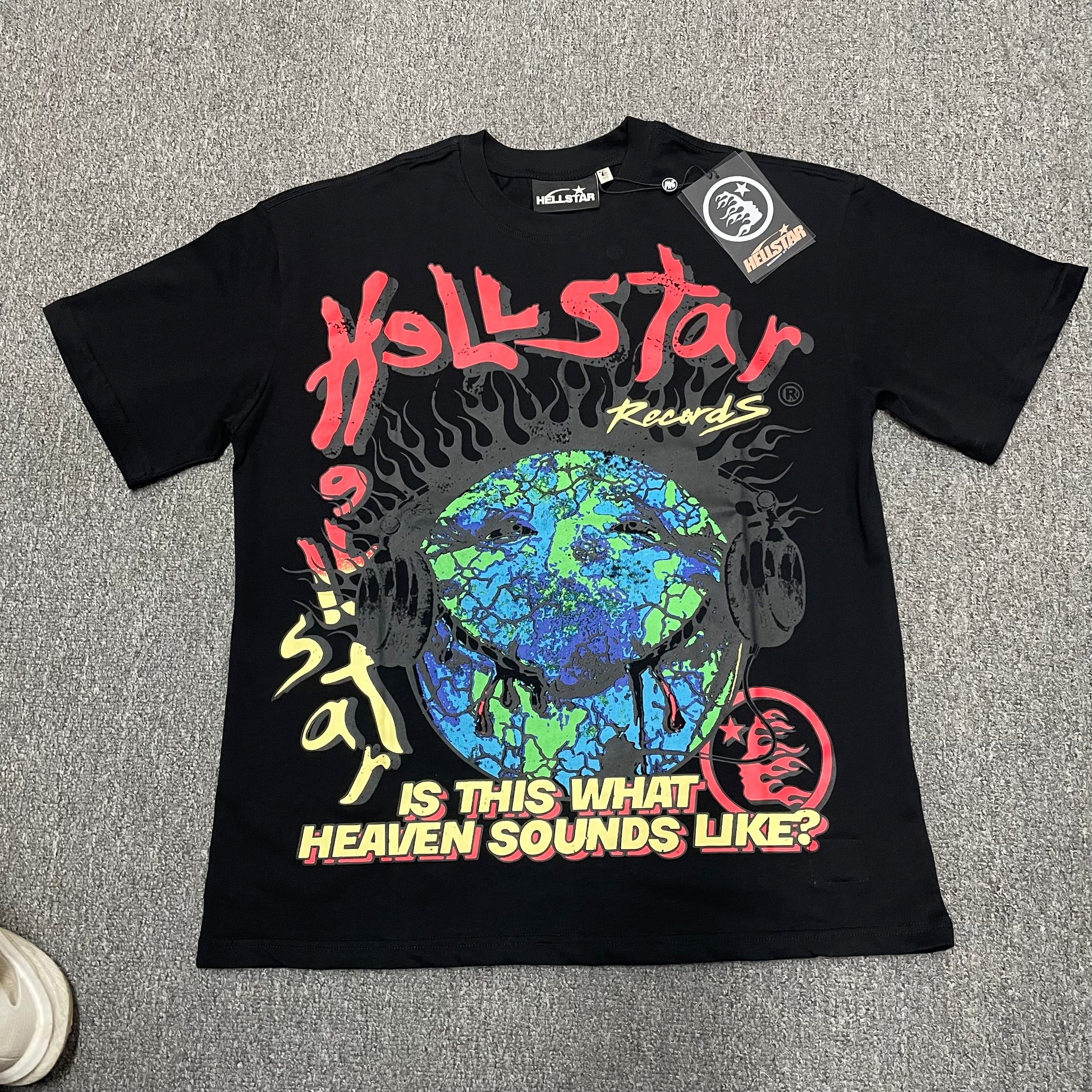 Hellstar Records Is This What Heaven Sounds Like T-Shirt in black front view with oversized Earth and headphones graphic