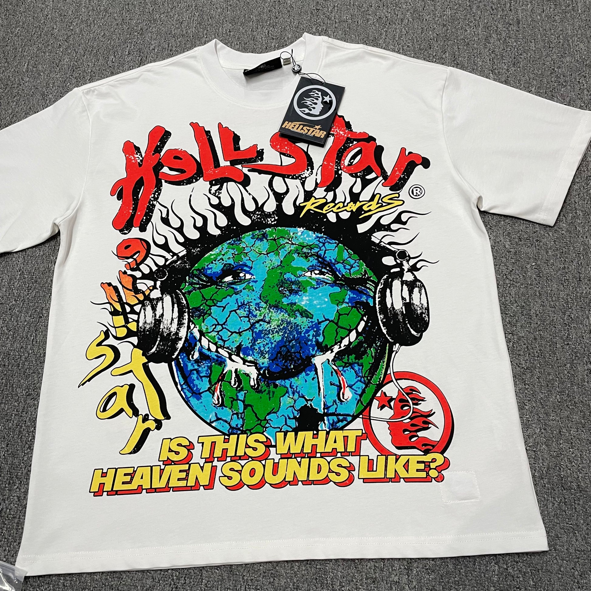 Hellstar Records Is This What Heaven Sounds Like T-Shirt in white front view with oversized Earth and headphones graphic