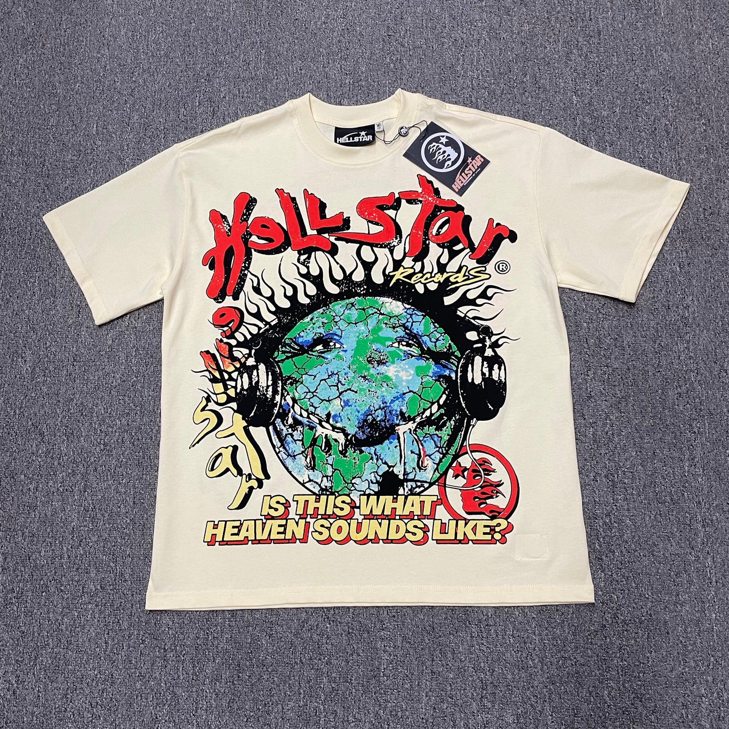 Hellstar Records Is This What Heaven Sounds Like T-Shirt in cream front view with oversized Earth and headphones graphic