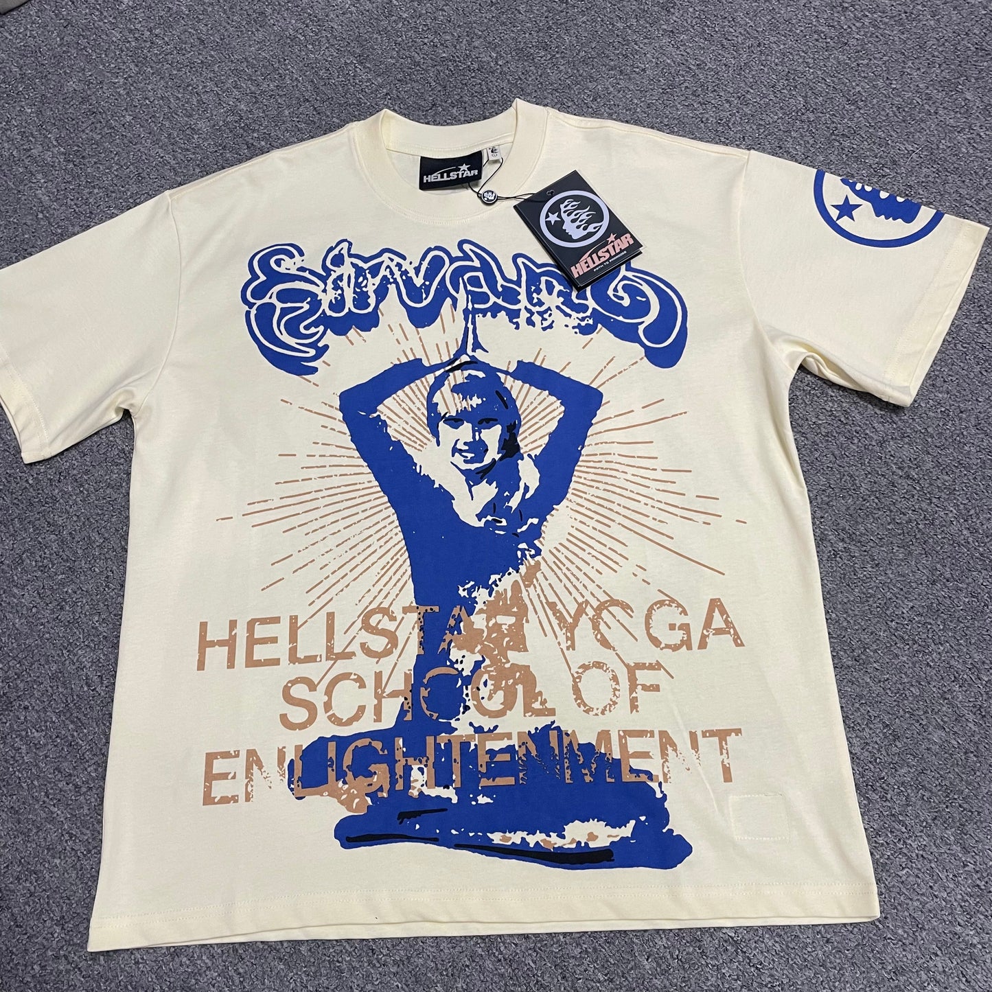 Hellstar Yoga School of Enlightenment T-Shirt in cream front view with oversized blue yoga graphic