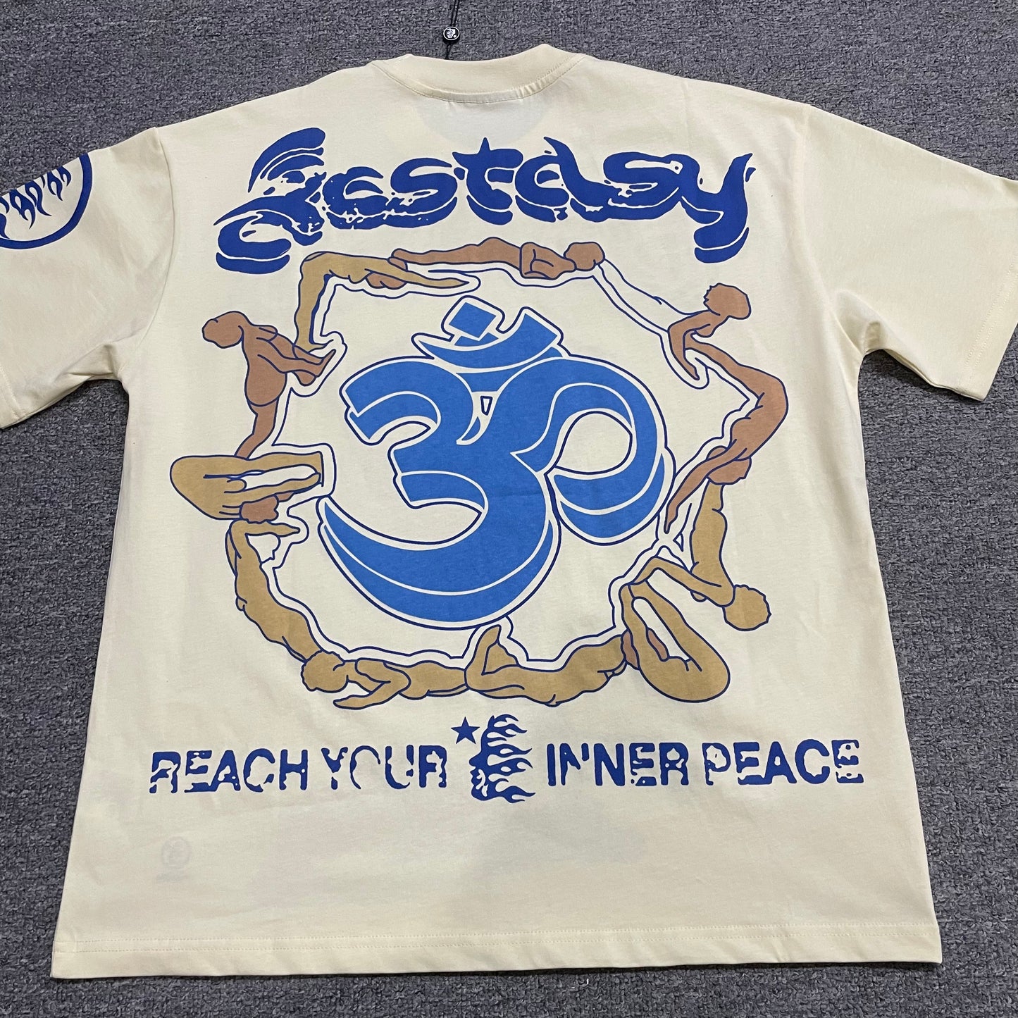 Hellstar Yoga School of Enlightenment cream T-shirt back view with blue Om symbol and inner peace graphic