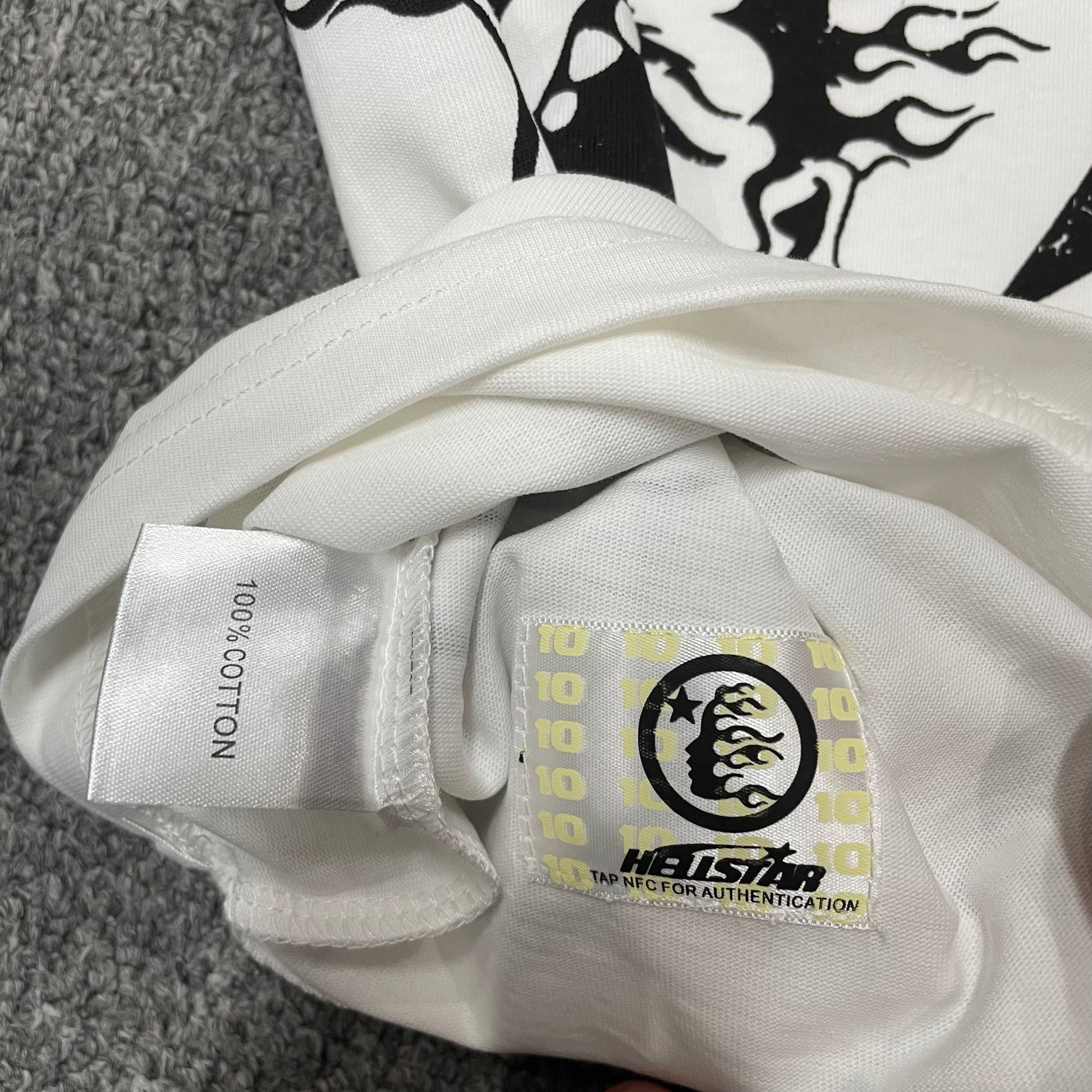 NFC tag detail on the Hellstar Path to Paradise T-Shirt for wholesale product inspection