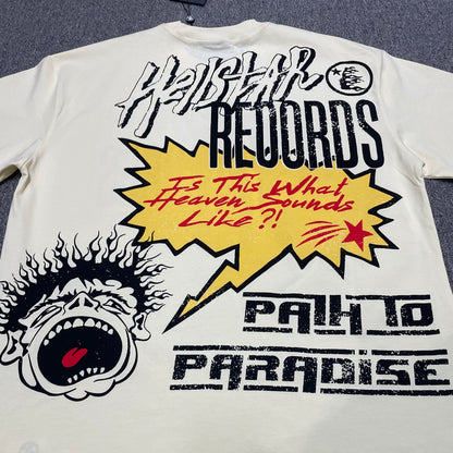 Full Hellstar Records Hollywood graphic print on the Path to Paradise T-Shirt
Close-up of the distressed Hellstar Records and Hollywood lettering print
Detailed view of the distressed red black and white print texture on the Hellstar T-Shirt
Oversized screaming-face side graphic with flame details on the Hellstar Path to Paradise T-Shirt
Close-up of the flame and open-mouth side artwork on the Hellstar graphic T-shirt
Full back graphic artwork on the Hellstar Path to Paradise Records T-Shirt