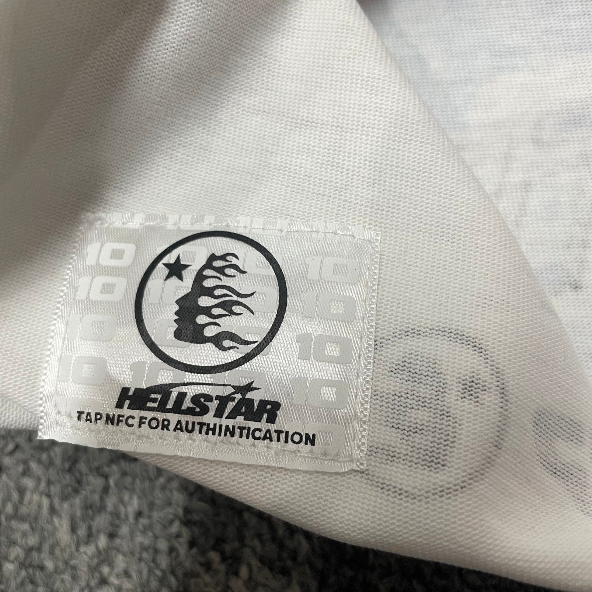 NFC tag detail on the Hellstar Online T-Shirt for wholesale product inspection