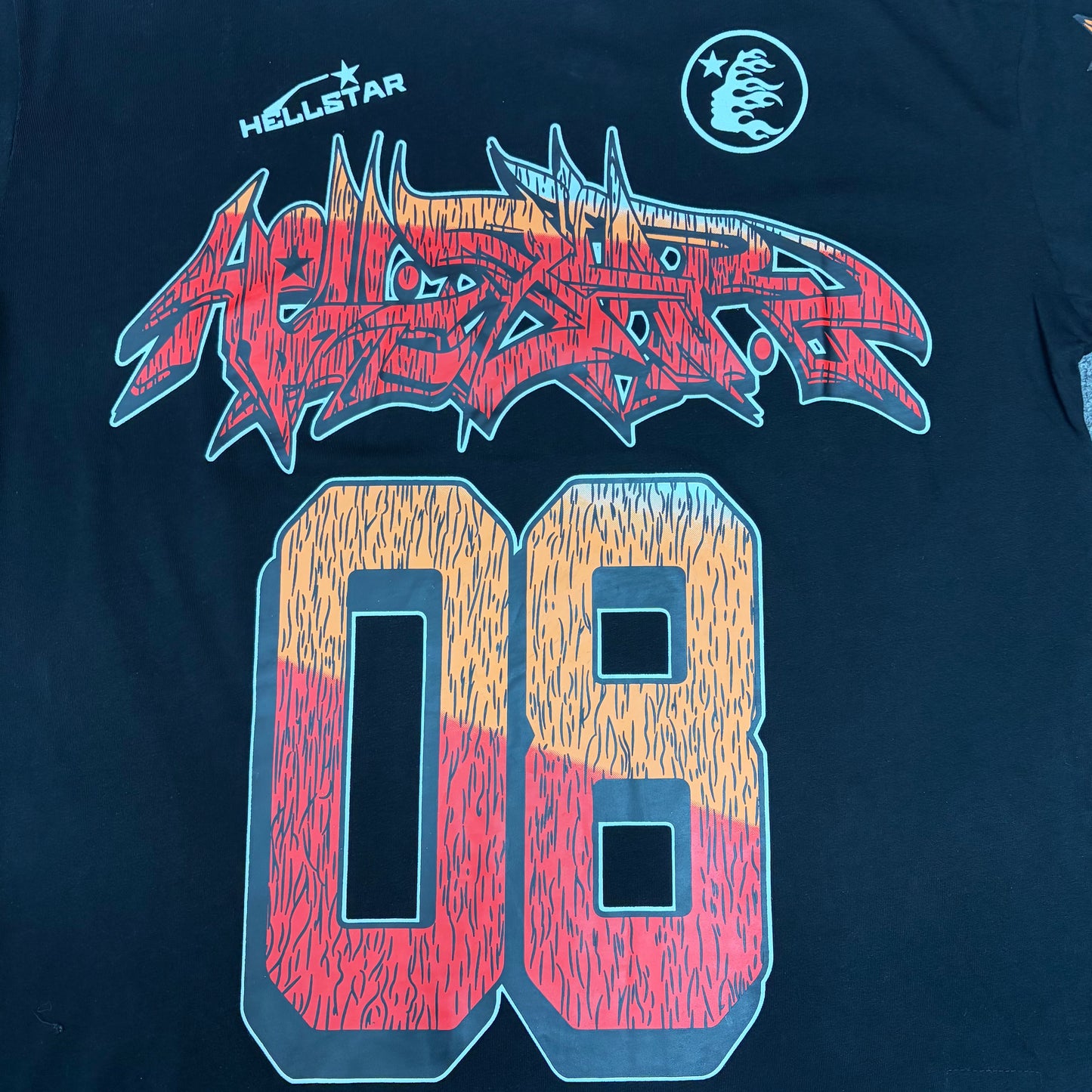 Full red and orange number 08 graphic on the black Hellstar Path to Paradise T-Shirt
Detailed view of the distressed red and orange number 08 print on the black Hellstar T-Shirt