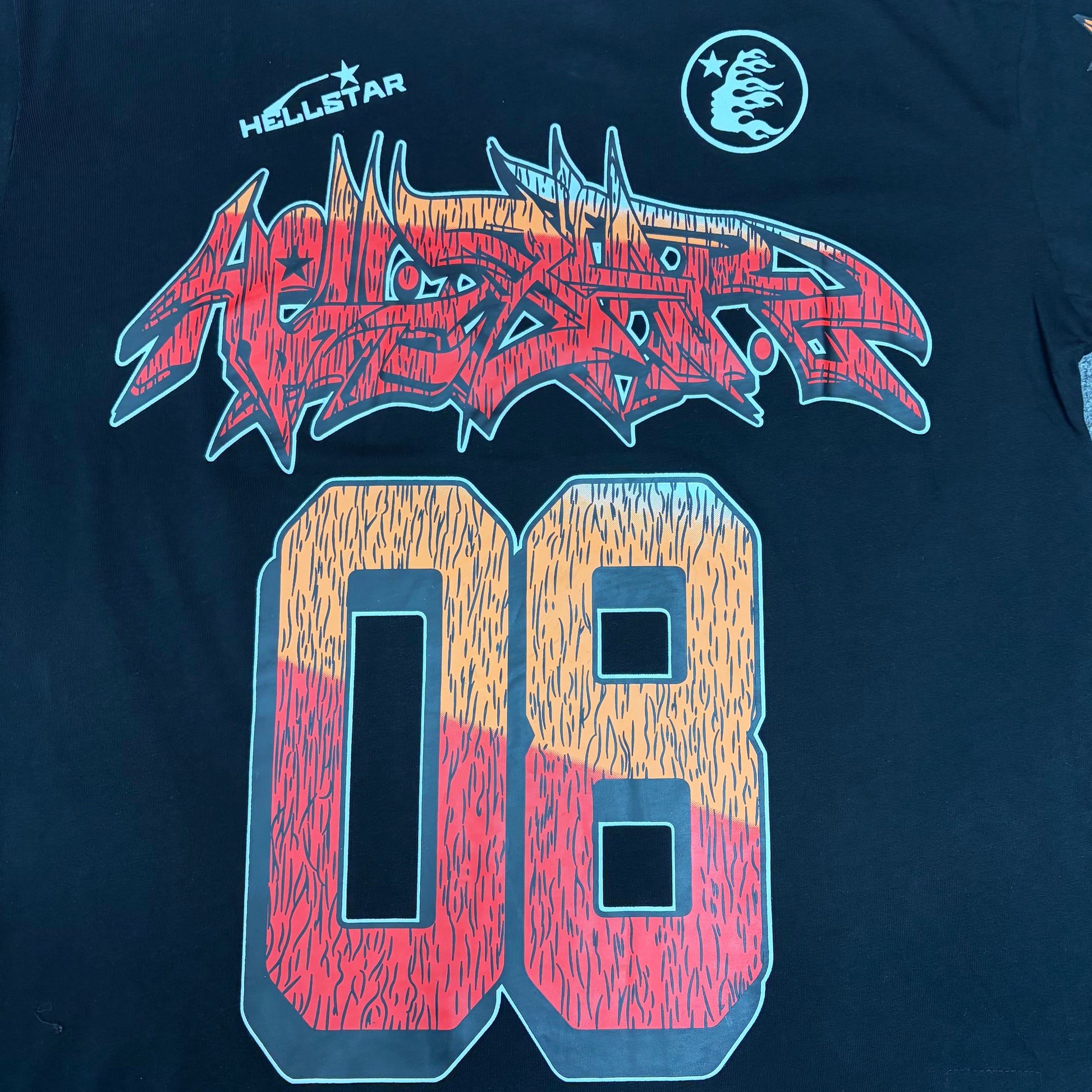 Full red and orange number 08 graphic on the black Hellstar Path to Paradise T-Shirt
Detailed view of the distressed red and orange number 08 print on the black Hellstar T-Shirt