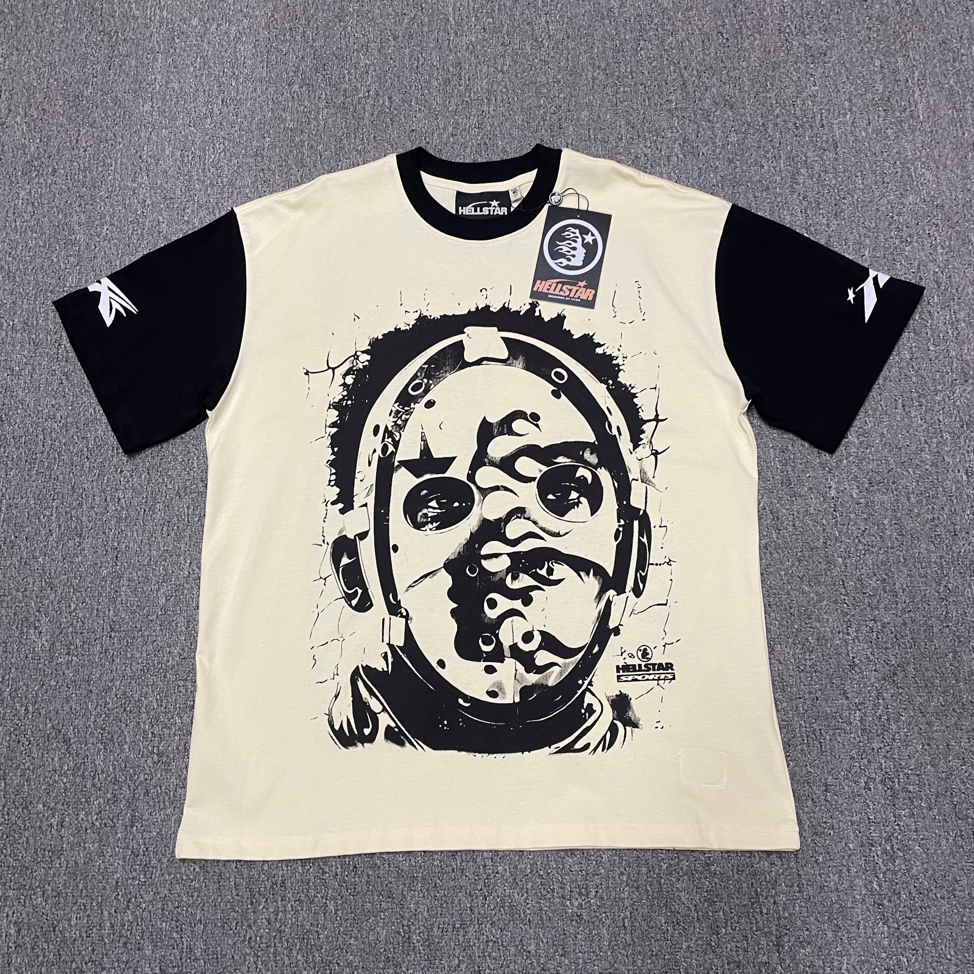 Hellstar Helmet Tee in Cream and Black front view with oversized helmeted face graphic