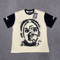 Hellstar Helmet Tee in Cream and Black front view with oversized helmeted face graphic