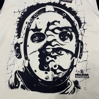 Full oversized helmet face graphic on the front of the Hellstar Helmet Tee
Close-up of the black helmeted face artwork on the Cream Hellstar graphic T-shirt
Detailed view of the distorted face and helmet illustration on the Hellstar Helmet Tee
Hellstar Sports logo detail beside the oversized helmet graphic on the Cream T-shirt