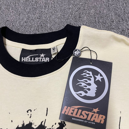 Hellstar branded neck label and contrast crew-neck stitching on the Helmet Tee
Size label detail inside the Cream and Black Hellstar Helmet T-Shirt
Hellstar branded hangtag attached to the Cream Helmet graphic T-shirt