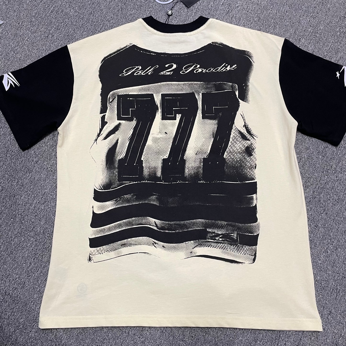 Hellstar Helmet Tee in Cream and Black back view with full rear graphic artwork