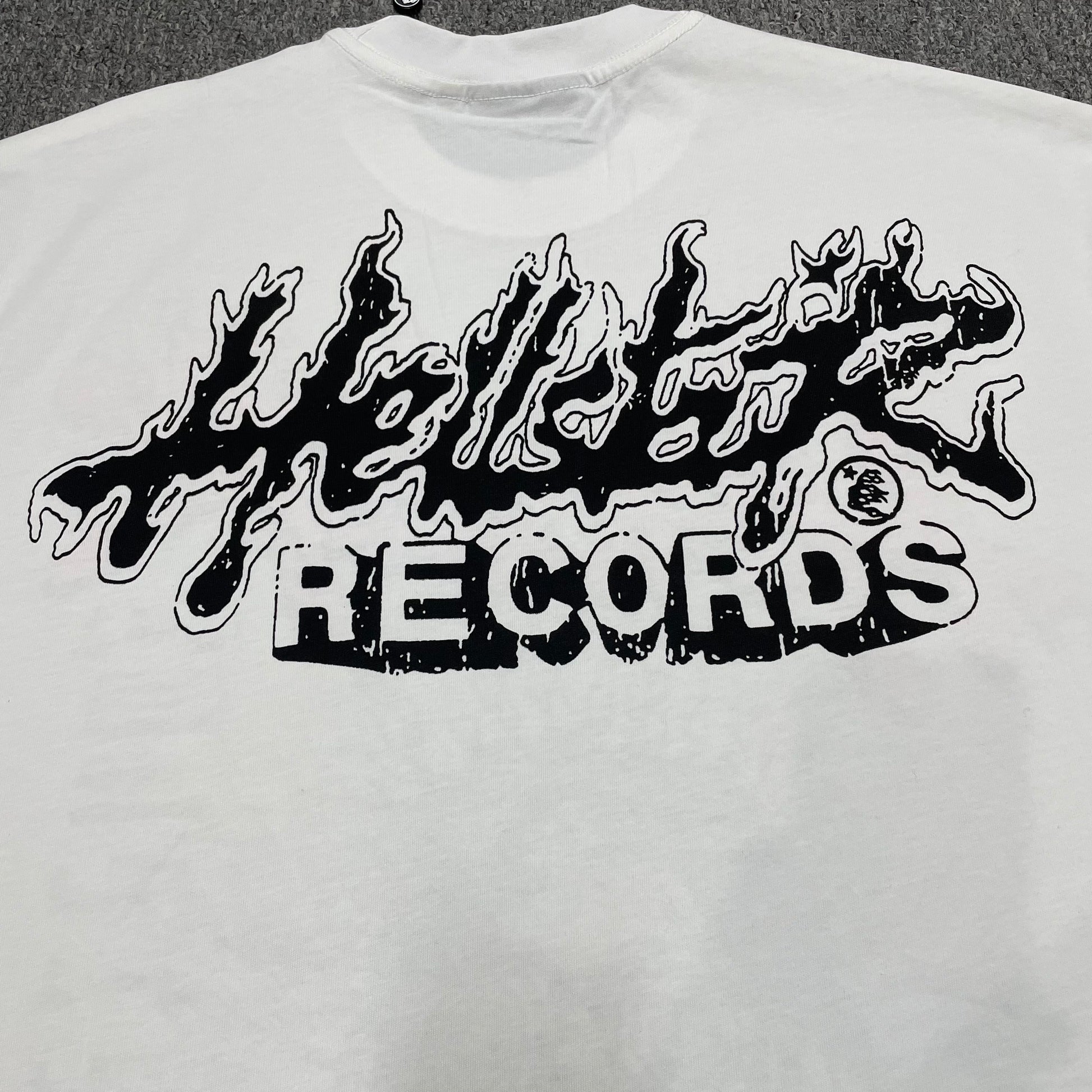 Full back graphic artwork on the Cream and Black Hellstar Helmet Tee
Close-up of the rear graphic print on the Hellstar Helmet T-Shirt
Detailed view of the distressed rear artwork on the Hellstar Helmet graphic T-shirt