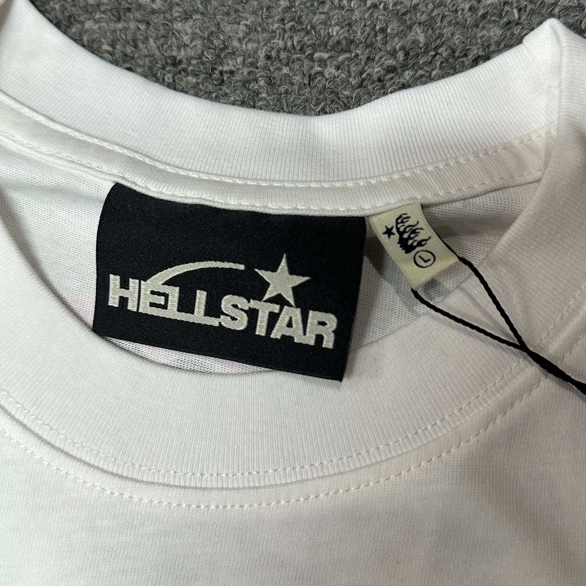 Hellstar branded neck label and crew-neck stitching on the No Guts No Glory T-Shirt
Size label detail inside the Hellstar No Guts No Glory graphic T-shirt