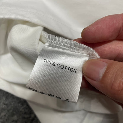 Hellstar Pixel T-Shirt wash label showing size fabric and garment care information