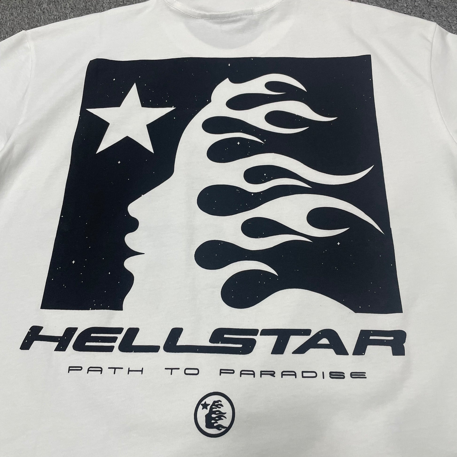 Full black flame-face graphic on the back of the Hellstar Path to Paradise T-Shirt
