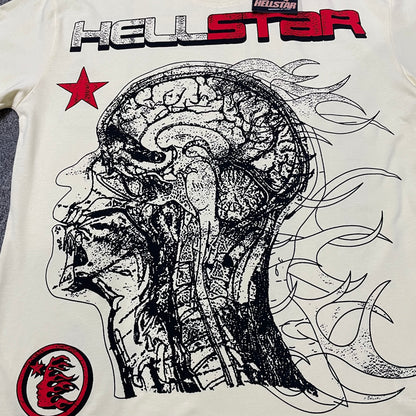 Full anatomical head graphic printed across the front of the Hellstar Human Development T-Shirt
Oversized human head anatomy illustration on the cream Hellstar Human Development T-Shirt
Flowing flame line artwork behind the anatomical head graphic on the Hellstar T-shirt
Red and white Hellstar wordmark printed above the anatomical head artwork