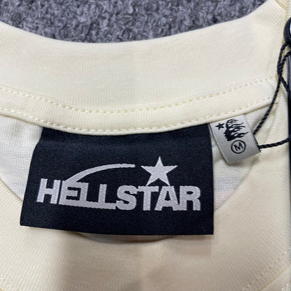 Hellstar branded neck label and crew-neck stitching on the Human Development T-Shirt
Size label detail inside the cream Hellstar Human Development T-Shirt
Cream ribbed crew-neck collar and stitching detail on the Hellstar graphic T-shirt