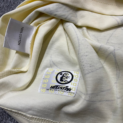 NFC tag detail on the Hellstar Human Development T-Shirt for product inspection
Hellstar Human Development T-Shirt wash label showing fabric size and garment care information