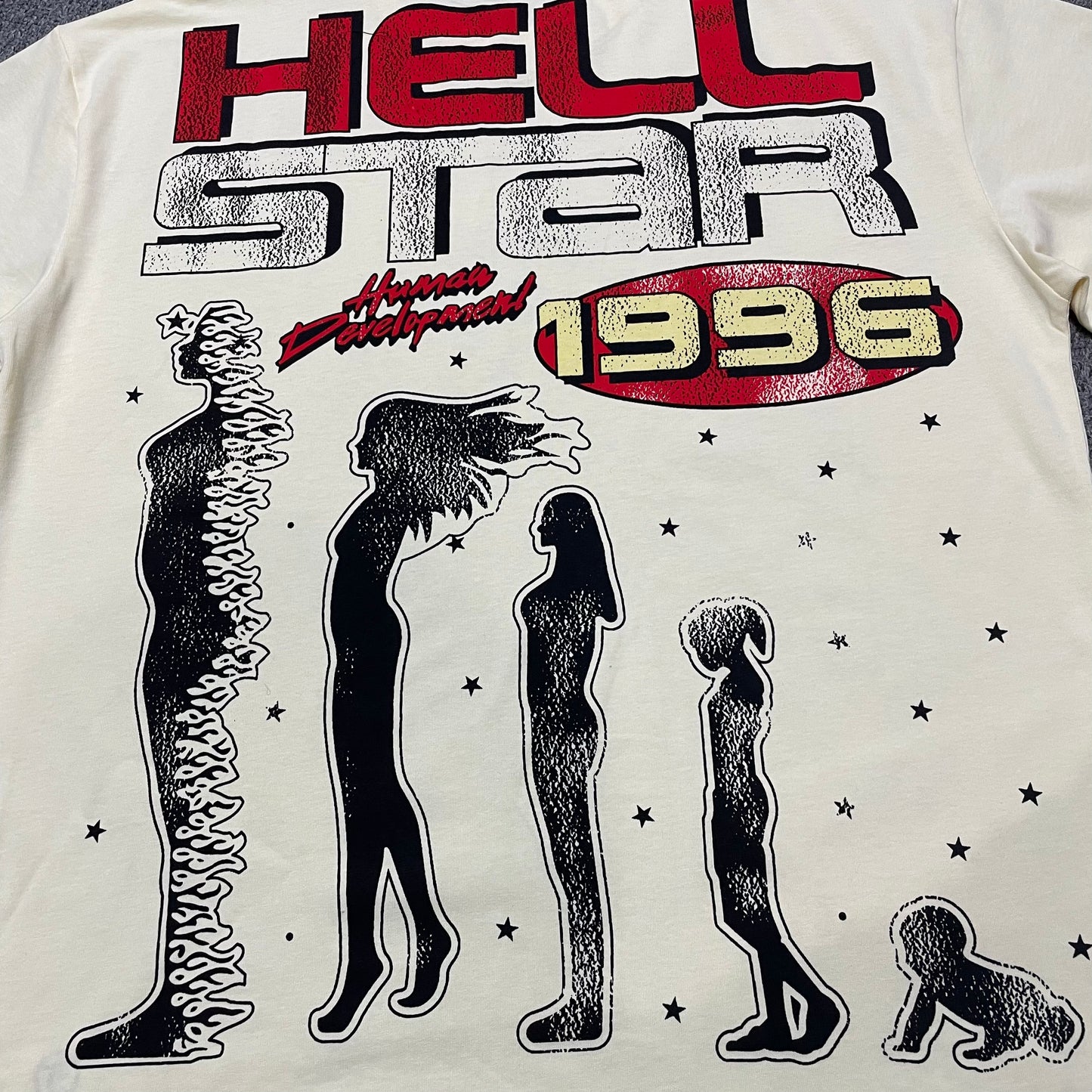 Close-up of the rear Human Development graphic on the cream Hellstar T-shirt
Hellstar 1996 lettering detail on the back of the Human Development T-Shirt
Human Development graphic artwork printed across the back of the Hellstar T-Shirt