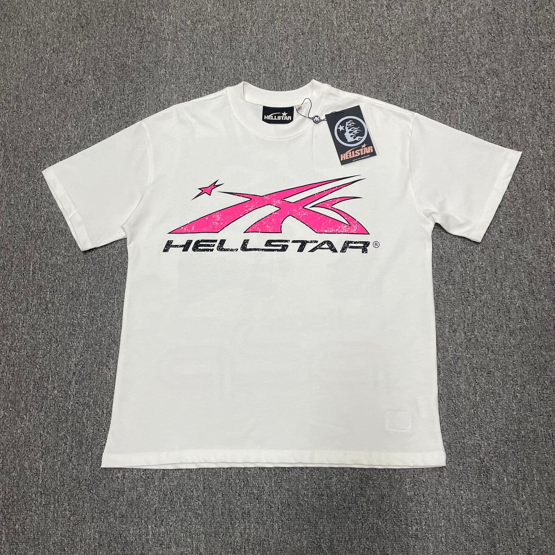 Hellstar Sport Logo T-Shirt in White and Pink front view with oversized motion-star graphic