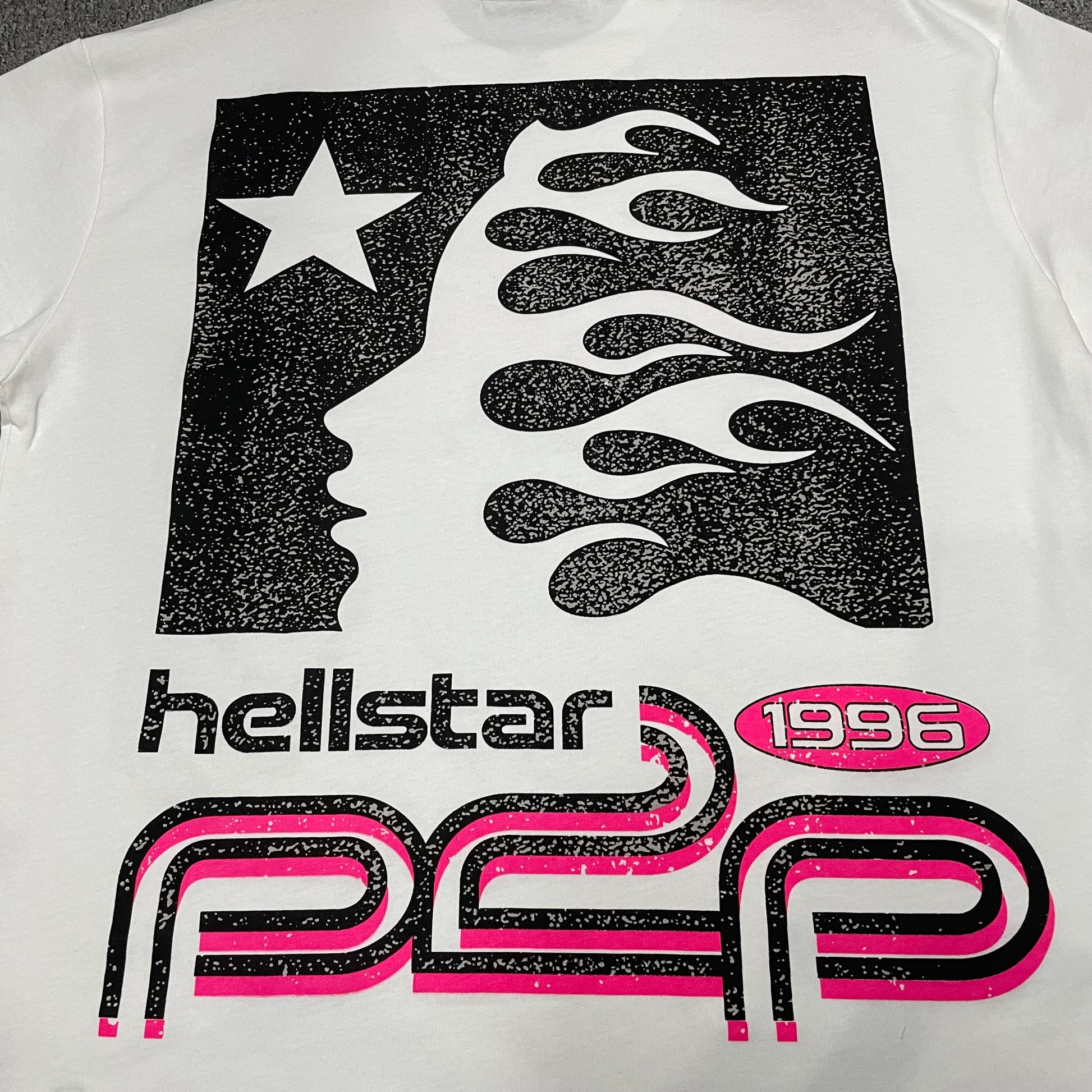 Full rear Hellstar graphic printed on the White and Pink Sport Logo T-Shirt
Close-up of the back graphic artwork on the Hellstar Sport Logo T-Shirt
Detailed view of the rear graphic print texture on the white Hellstar T-shirt