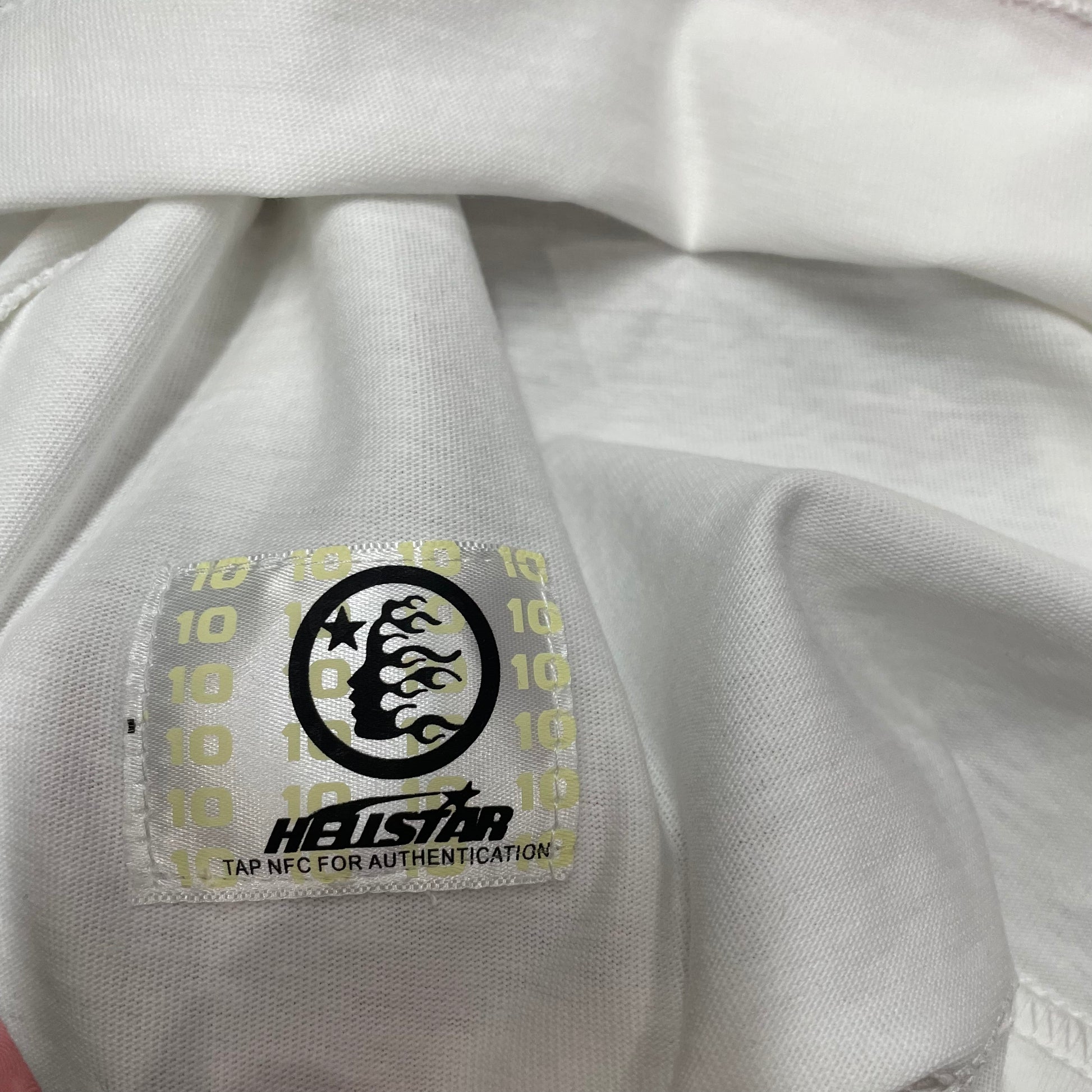 NFC tag detail on the Hellstar Sport Logo T-Shirt for product inspection
