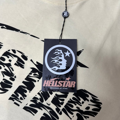 Hellstar branded hangtag attached to the cream Classic Logo graphic T-shirt