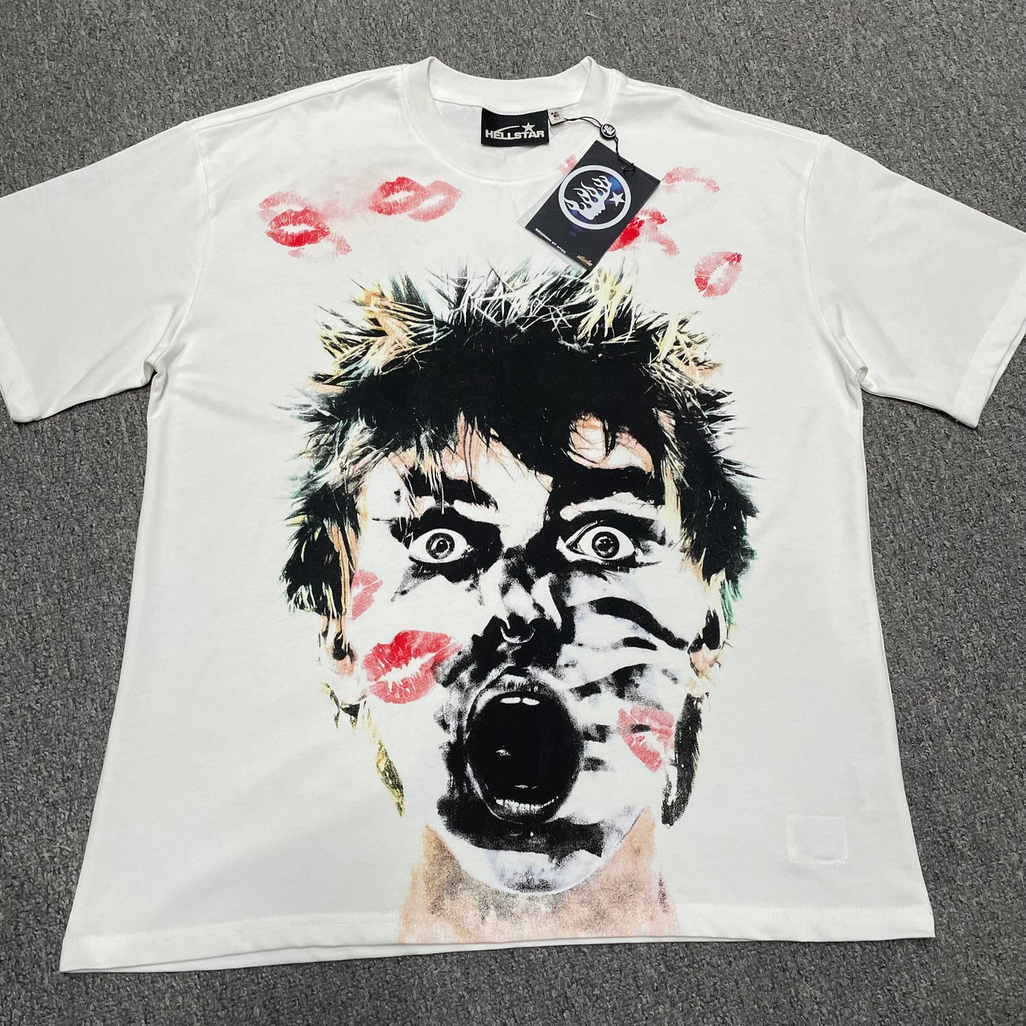 Hellstar French Kiss T-Shirt in white front view with oversized screaming face and red kiss-mark graphic