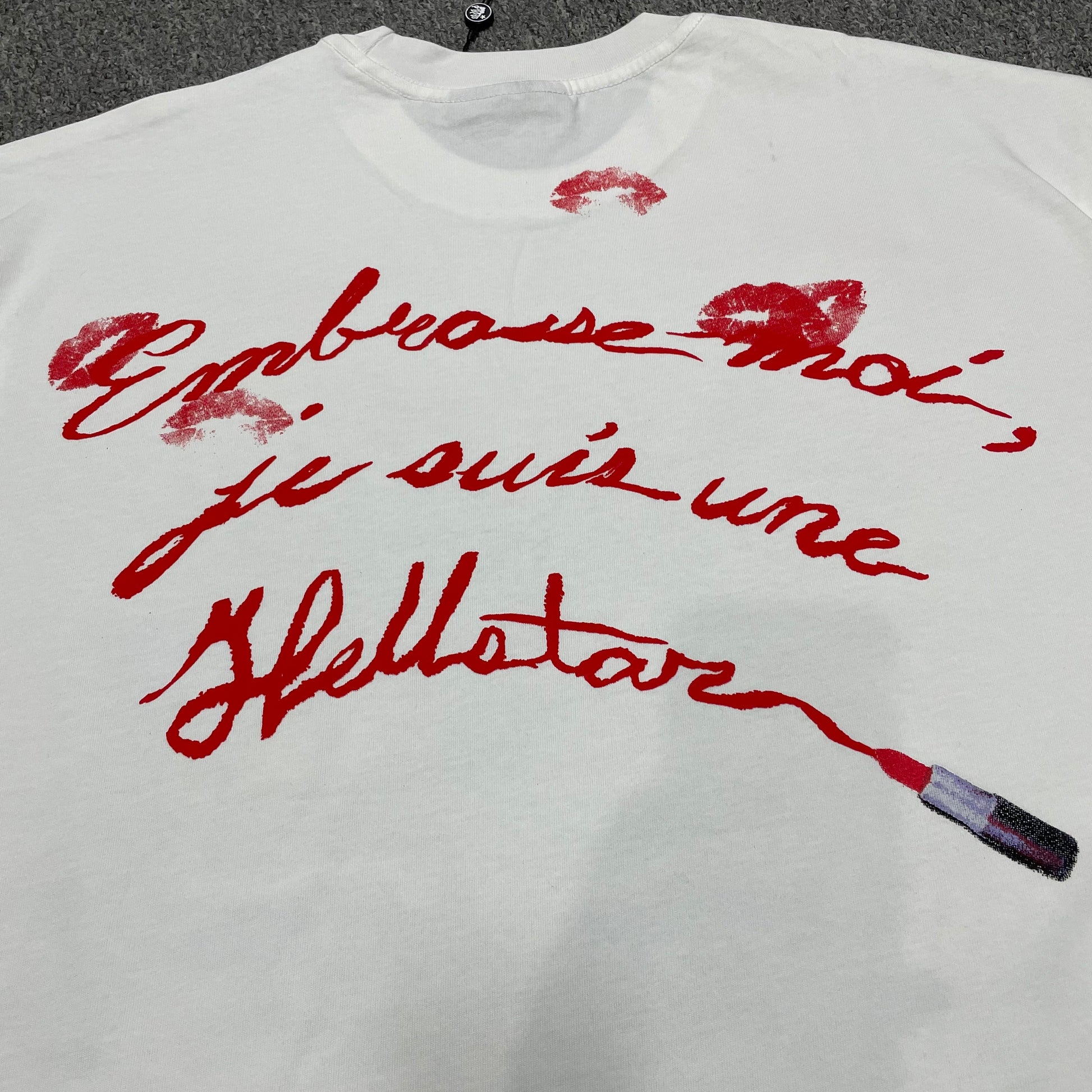 Full rear graphic print on the white Hellstar French Kiss T-Shirt
Close-up of the back artwork on the Hellstar French Kiss graphic T-shirt
Detailed view of the rear graphic print texture on the Hellstar French Kiss T-Shirt