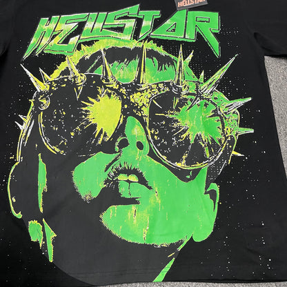 Close-up of the neon green blue and yellow artwork on the Hellstar The Future T-Shirt
Spiked goggles graphic detail on the Hellstar The Future black T-shirt
Close-up of the metallic-style spikes and goggles frame on the Hellstar T-Shirt
Large Hellstar logo printed above the neon portrait on The Future T-Shirt
Close-up of the blue green and white Hellstar logo lettering