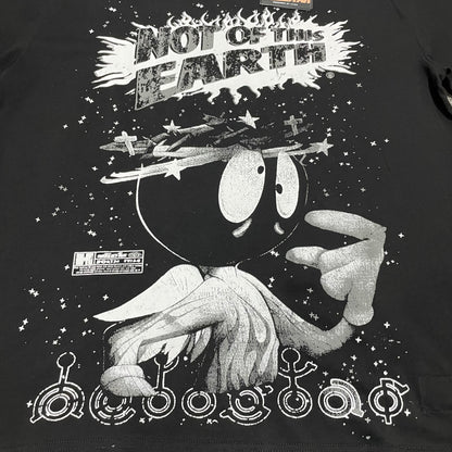 Full Not of This Earth graphic printed across the front of the black Hellstar T-Shirt
Not of This Earth slogan printed above the cartoon-style space character graphic
Flame-shaped lettering detail around the Not of This Earth slogan
Oversized cartoon-style space character graphic on the Hellstar Not of This Earth T-Shirt