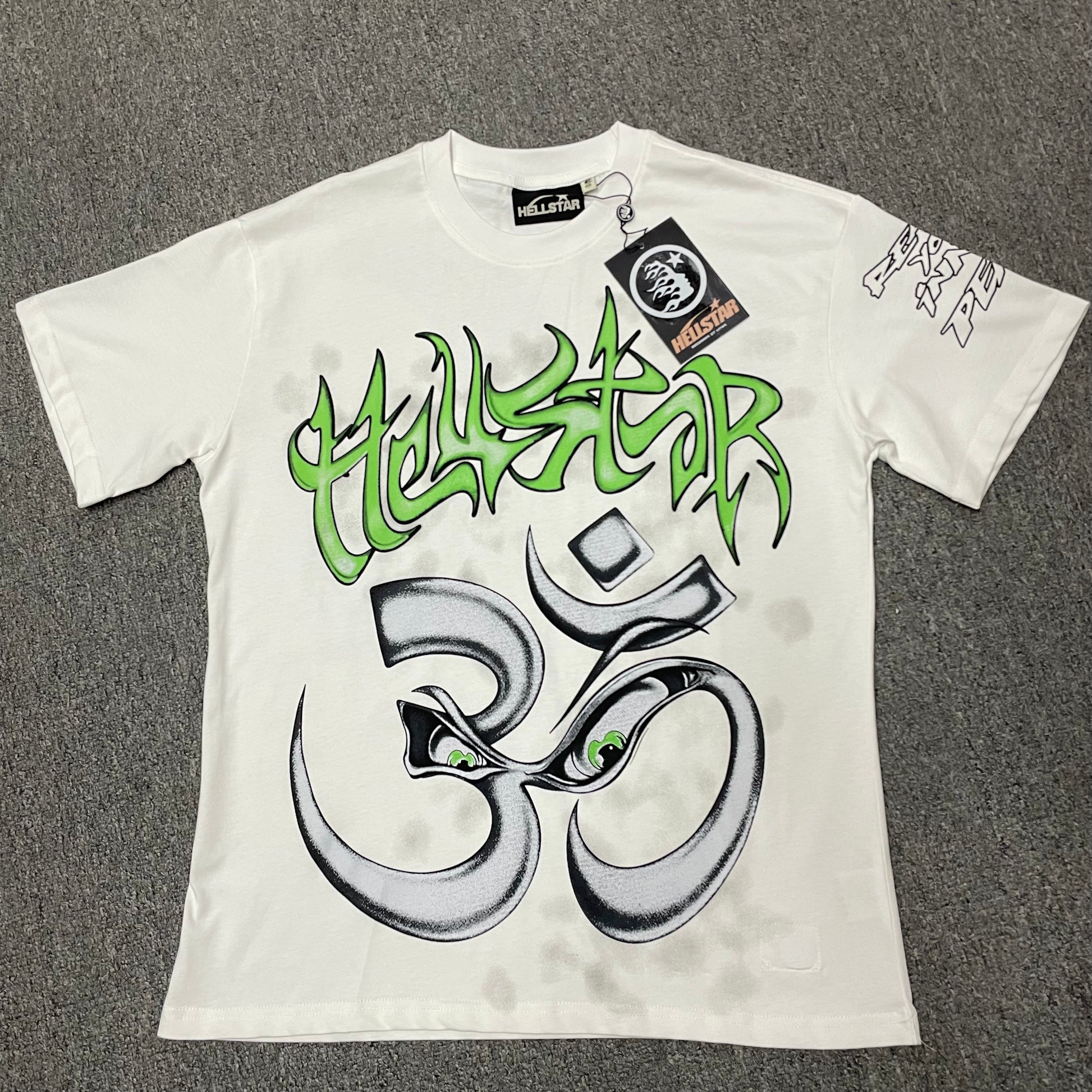 Hellstar Reach Your Inner Peace Om T-Shirt in white front view with green logo and oversized yoga symbol