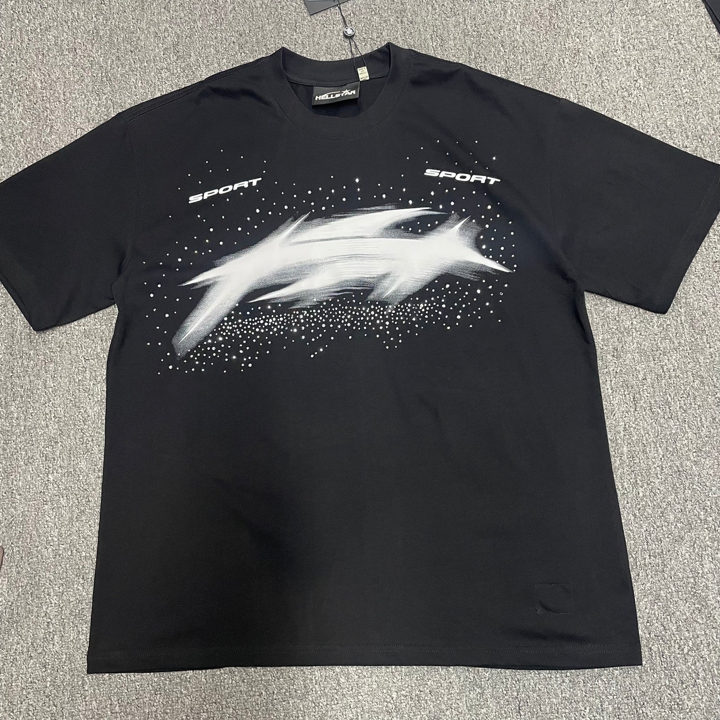 Hellstar Blur Rhinestone T-Shirt in black front view with distorted white motion graphic