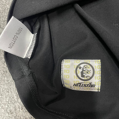 Hellstar Blur T-Shirt wash label showing size fabric and garment care information
NFC tag detail on the Hellstar Blur T-Shirt for product inspection