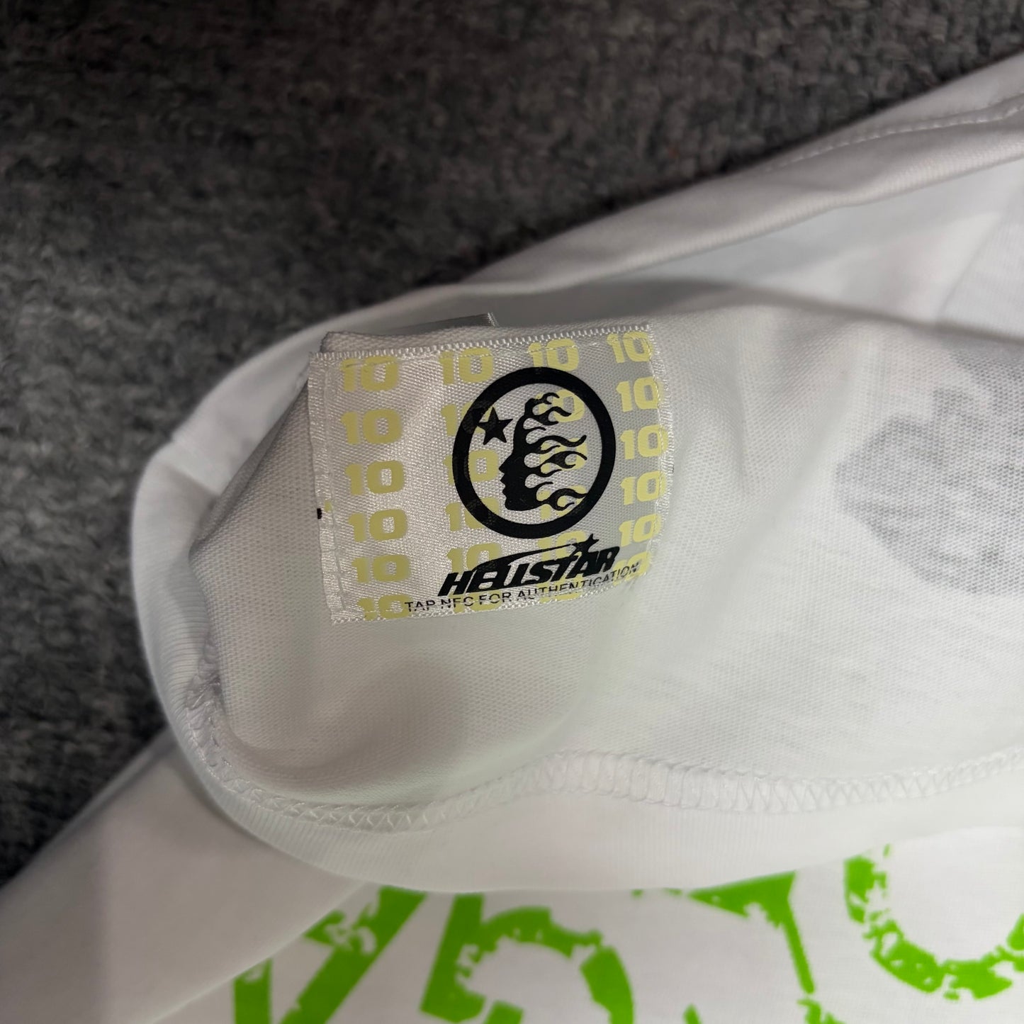 NFC tag detail on the Hellstar Reach Your Inner Peace T-Shirt for product inspection