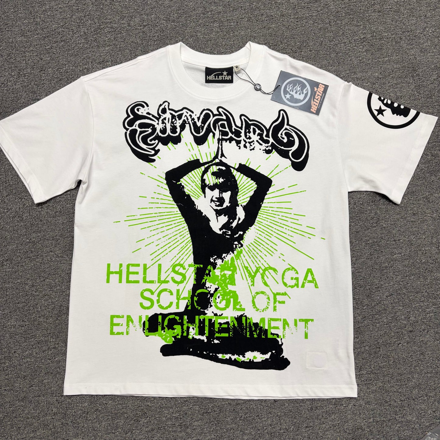 Hellstar Reach Your Inner Peace Om T-Shirt in white front view with green logo and oversized Om graphic