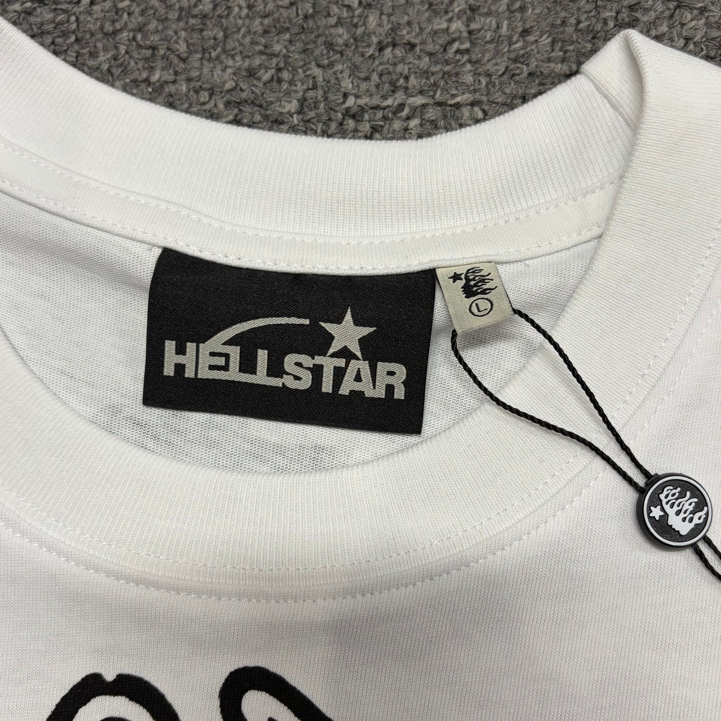 Hellstar branded neck label and crew-neck stitching on the Reach Your Inner Peace T-Shirt
Ribbed crew-neck collar and stitching detail on the Hellstar yoga graphic T-shirt
Size label detail inside the Hellstar Reach Your Inner Peace Om T-Shirt