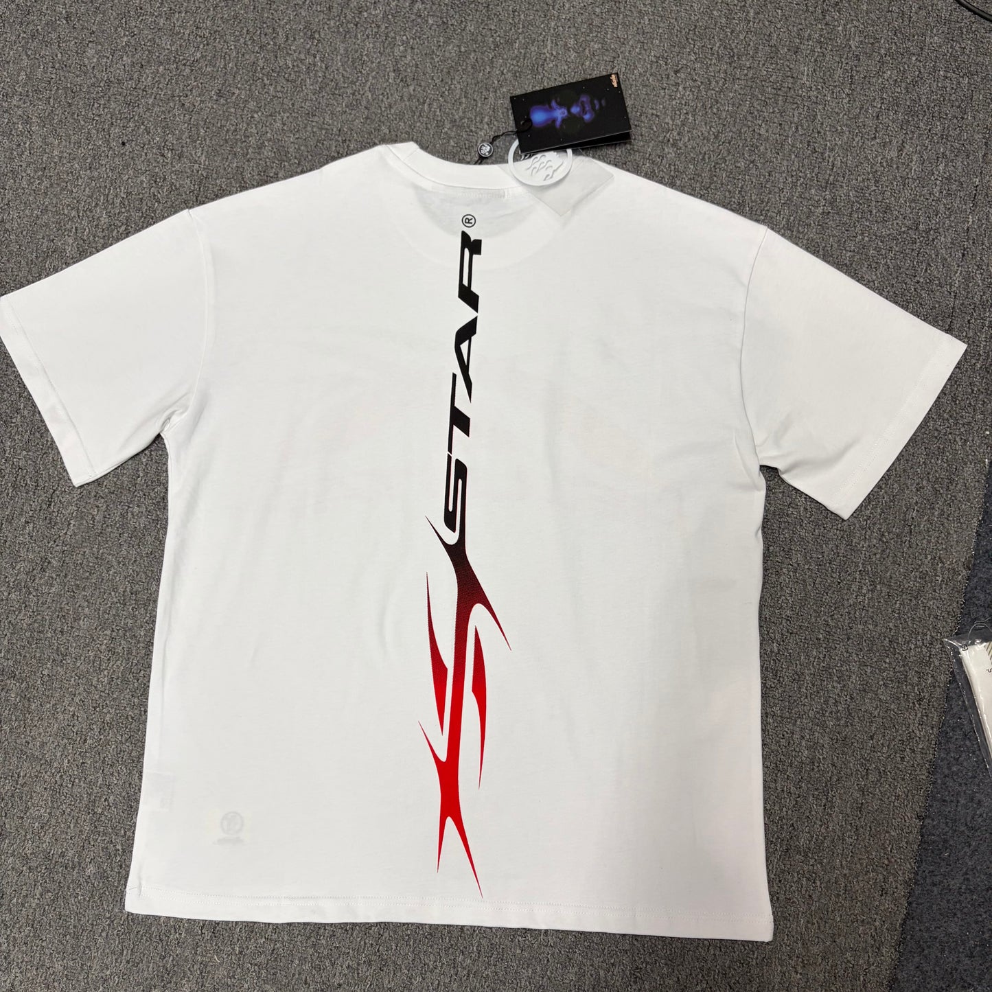 Hellstar Gradient Flame Sports Logo white T-shirt back view with complete rear graphic artwork