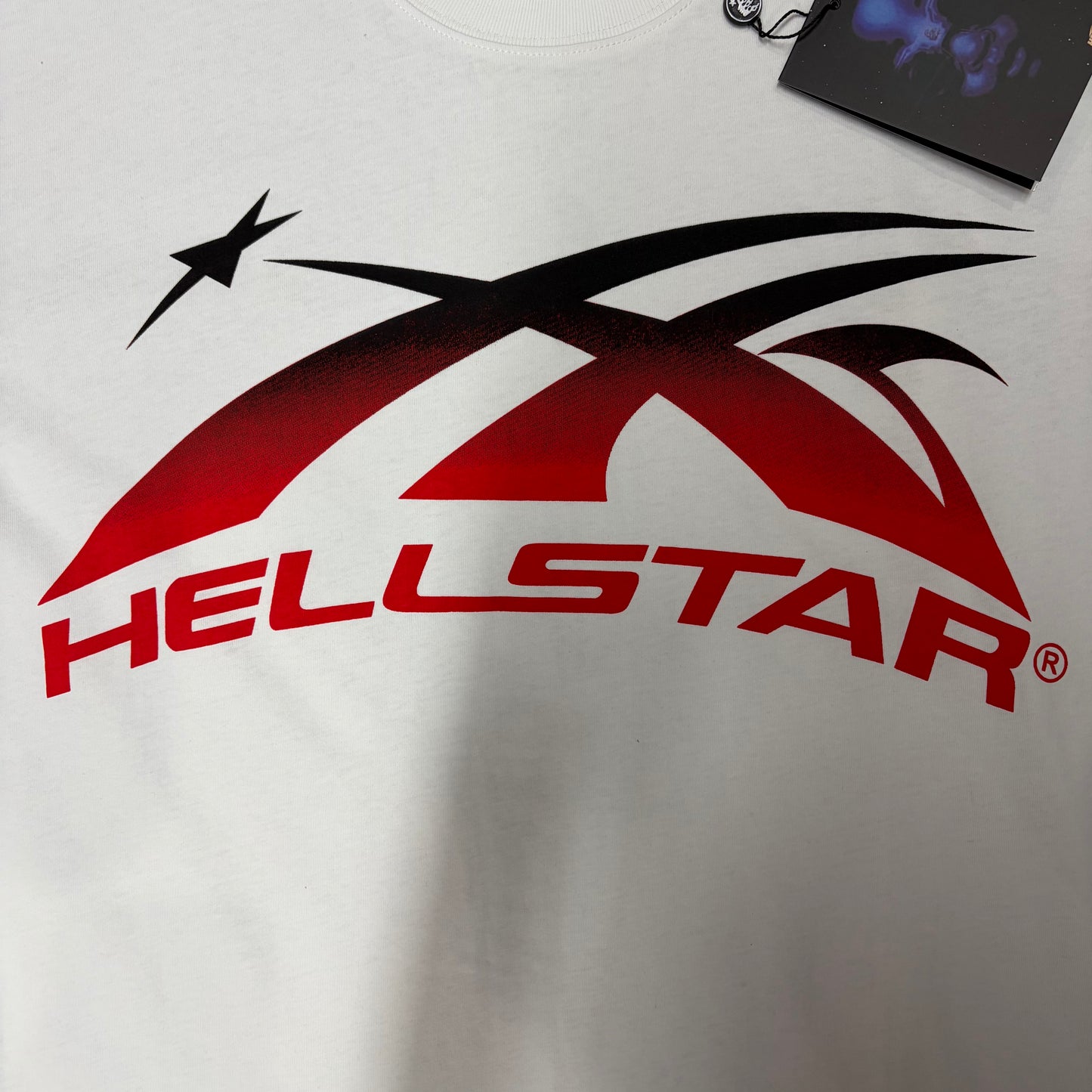 Gel-print front graphic on the Hellstar Gradient Flame Sports Logo T-Shirt
Detailed view of the gel-print thickness on the Hellstar Gradient Flame graphic
