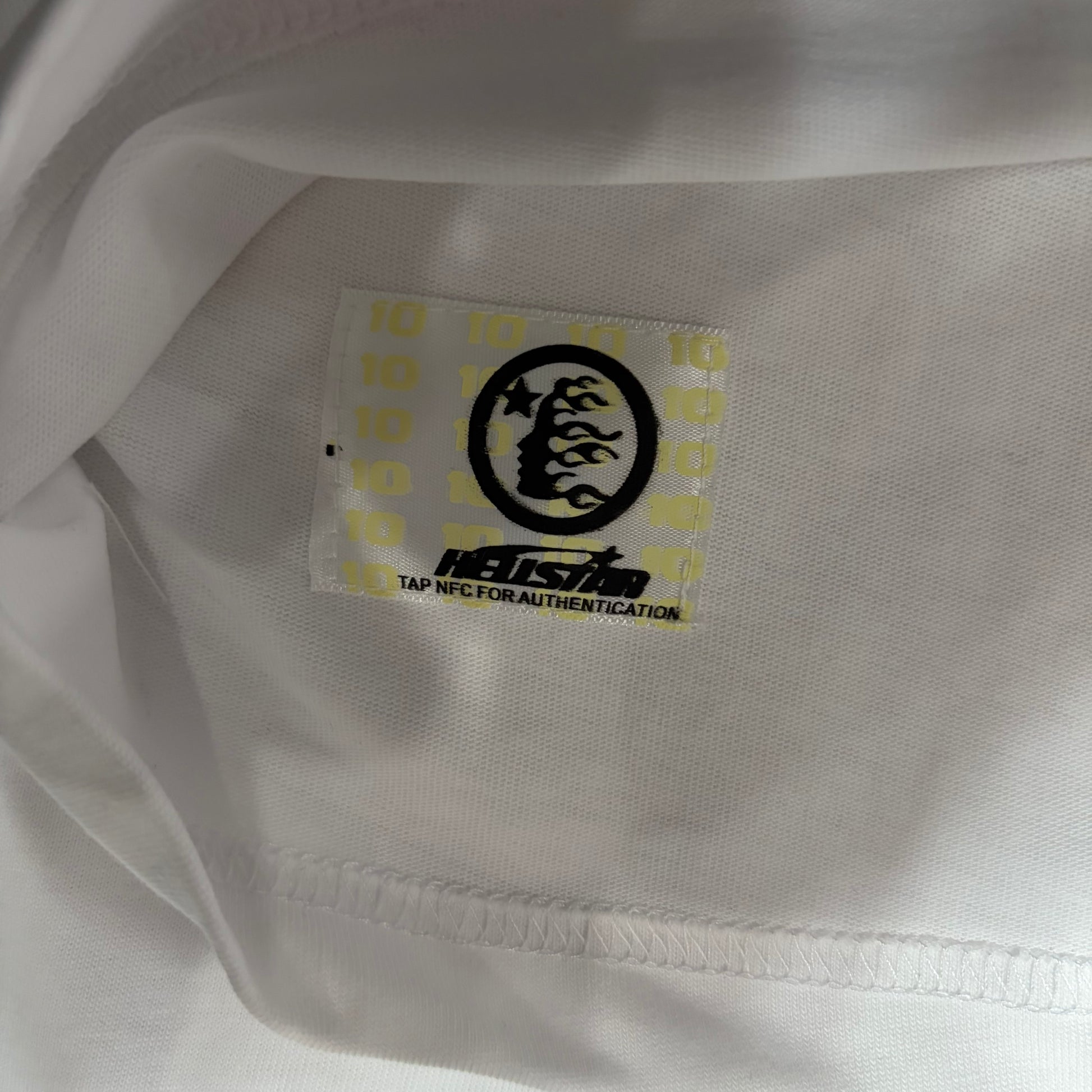 NFC tag detail on the Hellstar Gradient Flame Sports Logo T-Shirt