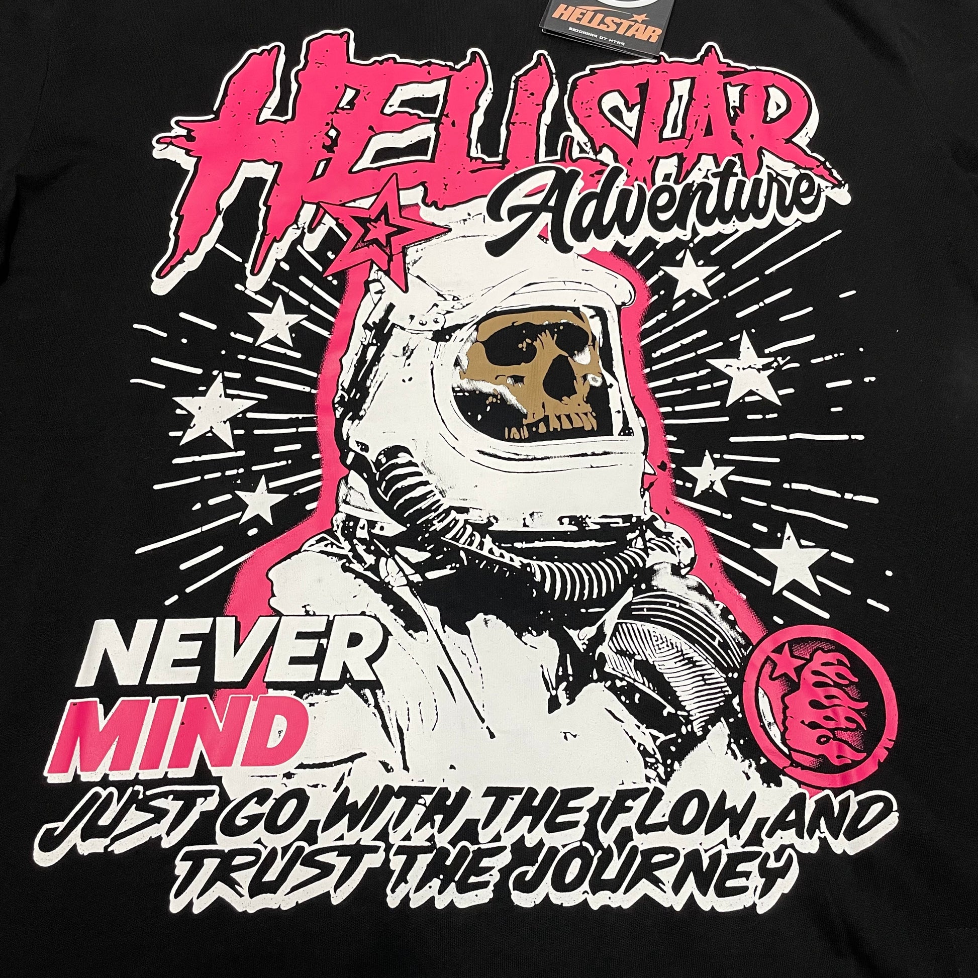 Full Hellstar Adventure astronaut graphic printed across the front of the black T-shirt
Bold pink Hellstar logo lettering above the astronaut graphic on the black T-shirt
Close-up of the skull inside the astronaut helmet on the Hellstar Adventure T-Shirt
Never Mind slogan printed beside the astronaut graphic on the Hellstar T-Shirt